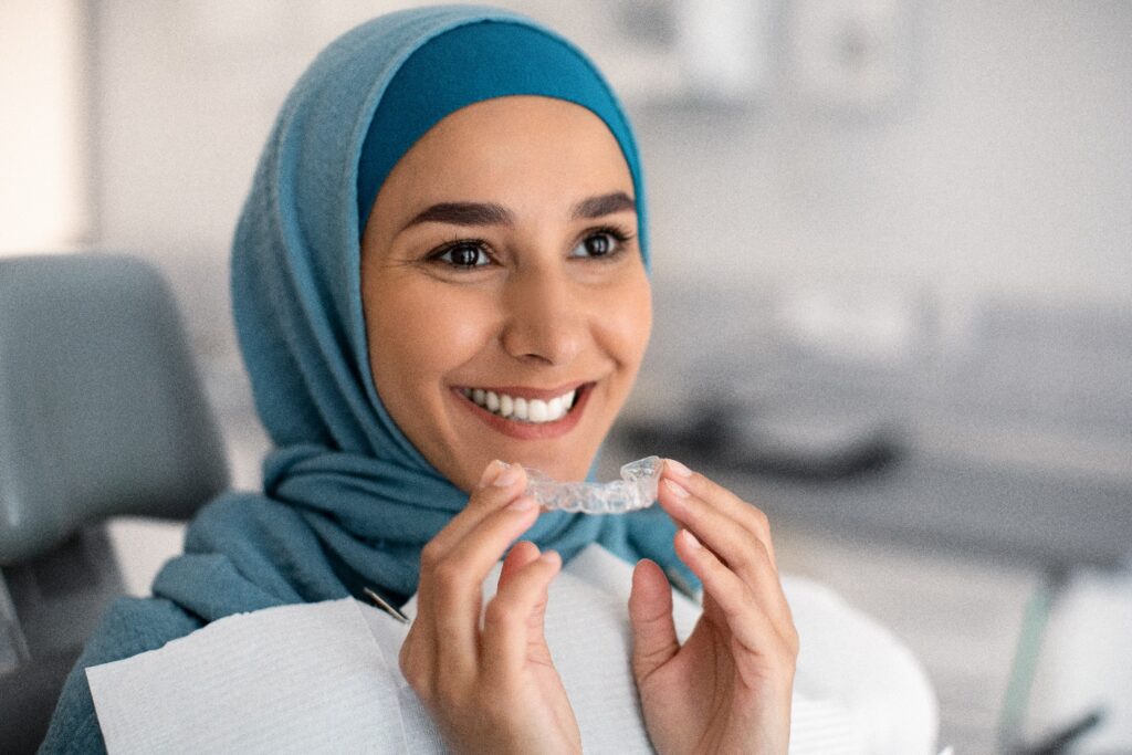 Lady smiles before wearing Invisalign clear aligners